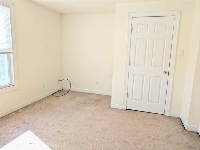 an empty room with a bench