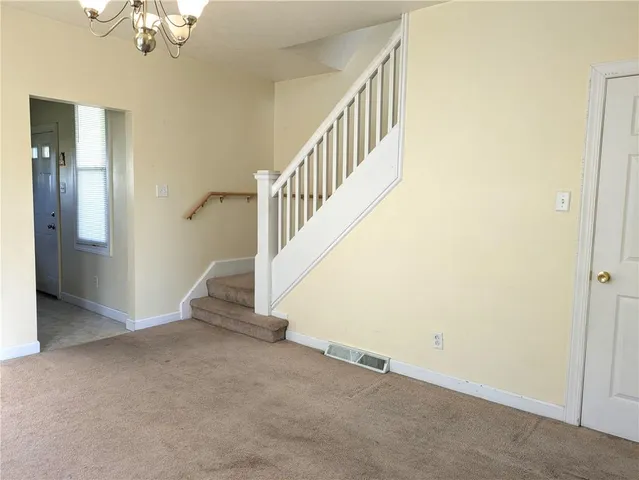 a view of a hallway with staircase