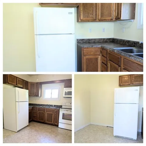 a kitchen with a refrigerator and a stove top oven