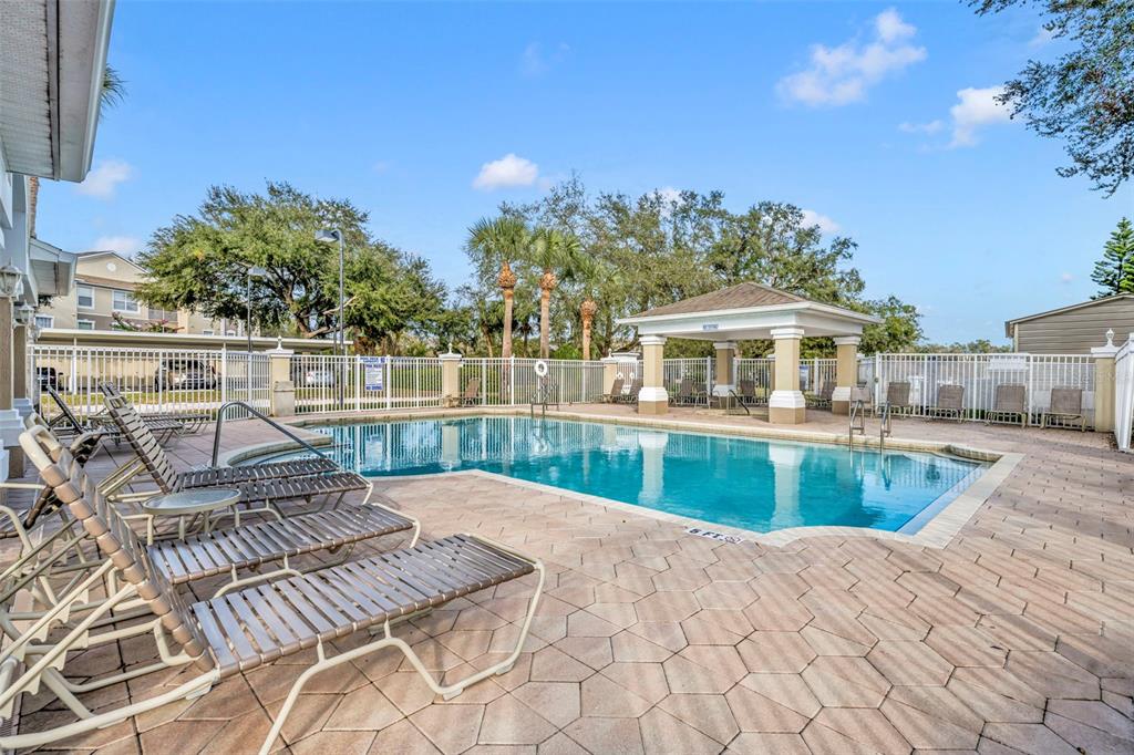 582 Brantley Terrace Way, Unit 304 Altamonte Springs, FL 32714 - Photo 5 of 30 a view of a house with pool and chairs