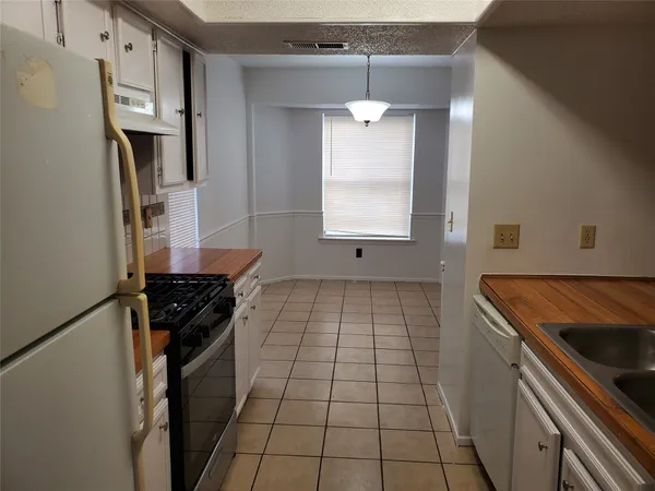 a kitchen with a sink and a window