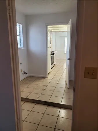 a white toilet sitting next to a bath tub