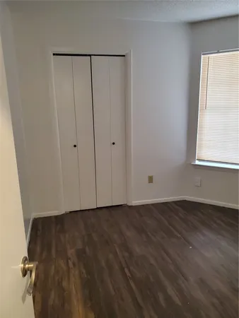 a view of hallway with wooden floor