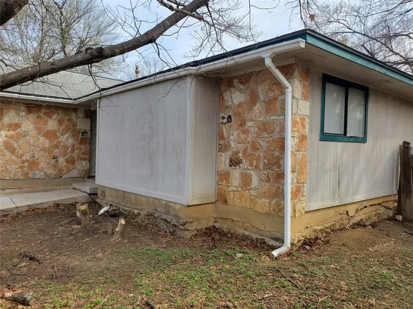 a backyard of a house with lots of green space