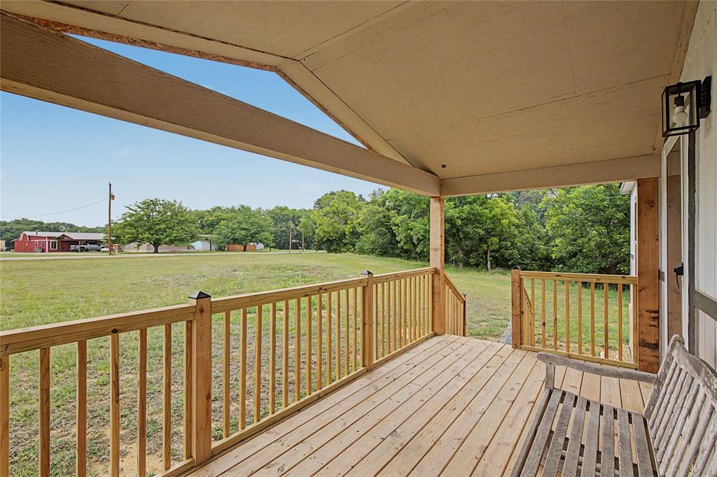 6065 Timber Trail Azle, TX 76020 - Photo 6 of 33 a view of balcony with wooden floor and outdoor space