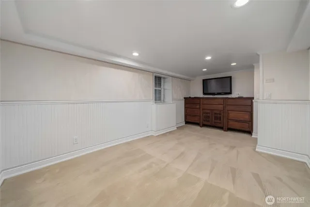 a view of an empty room with a kitchen