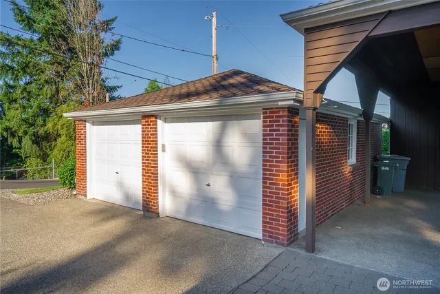 a view of a house with a door and wooden walls