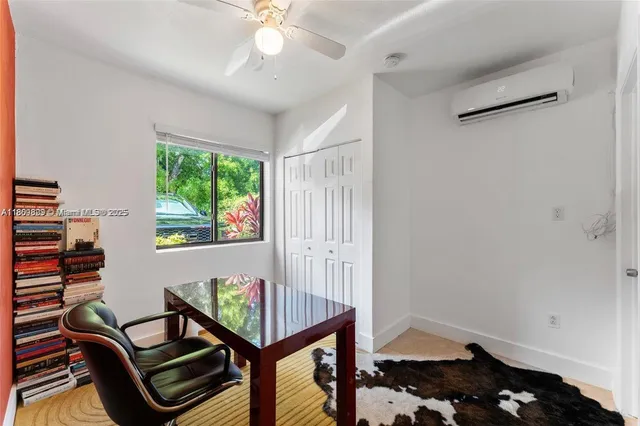 a view of a livingroom with furniture and staircase