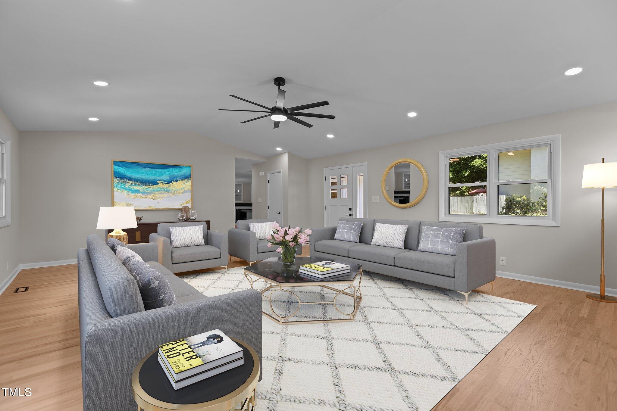 2505 Catalina Court Raleigh, NC 27607 - Photo 12 of 25 a living room with furniture and a wooden floor