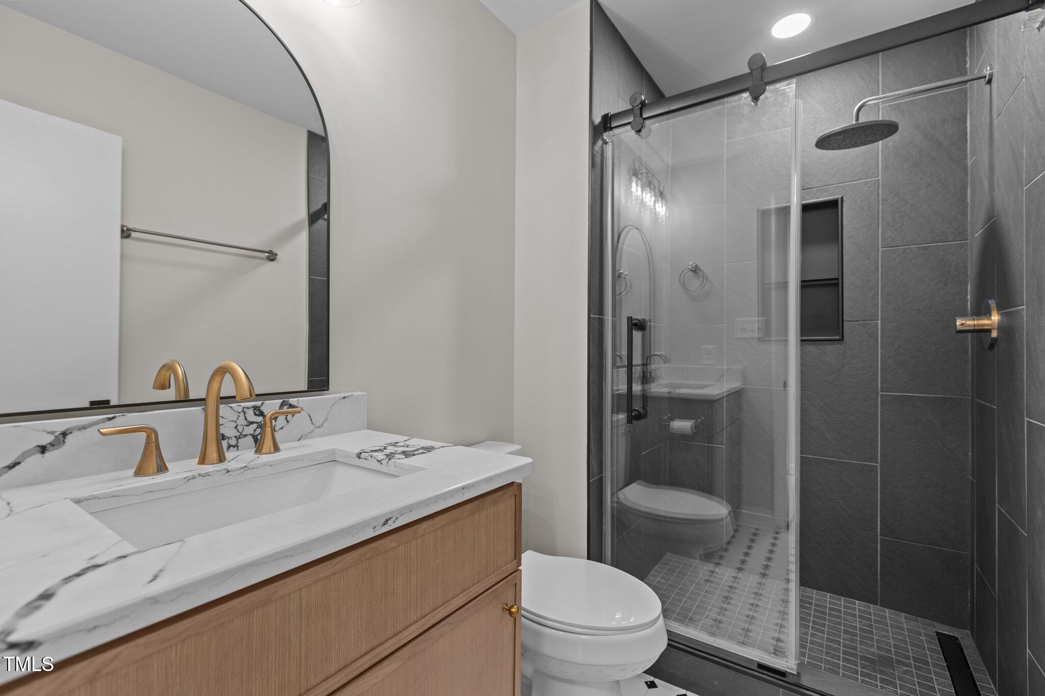 2505 Catalina Court Raleigh, NC 27607 - Photo 15 of 25 a bathroom with a sink toilet and shower