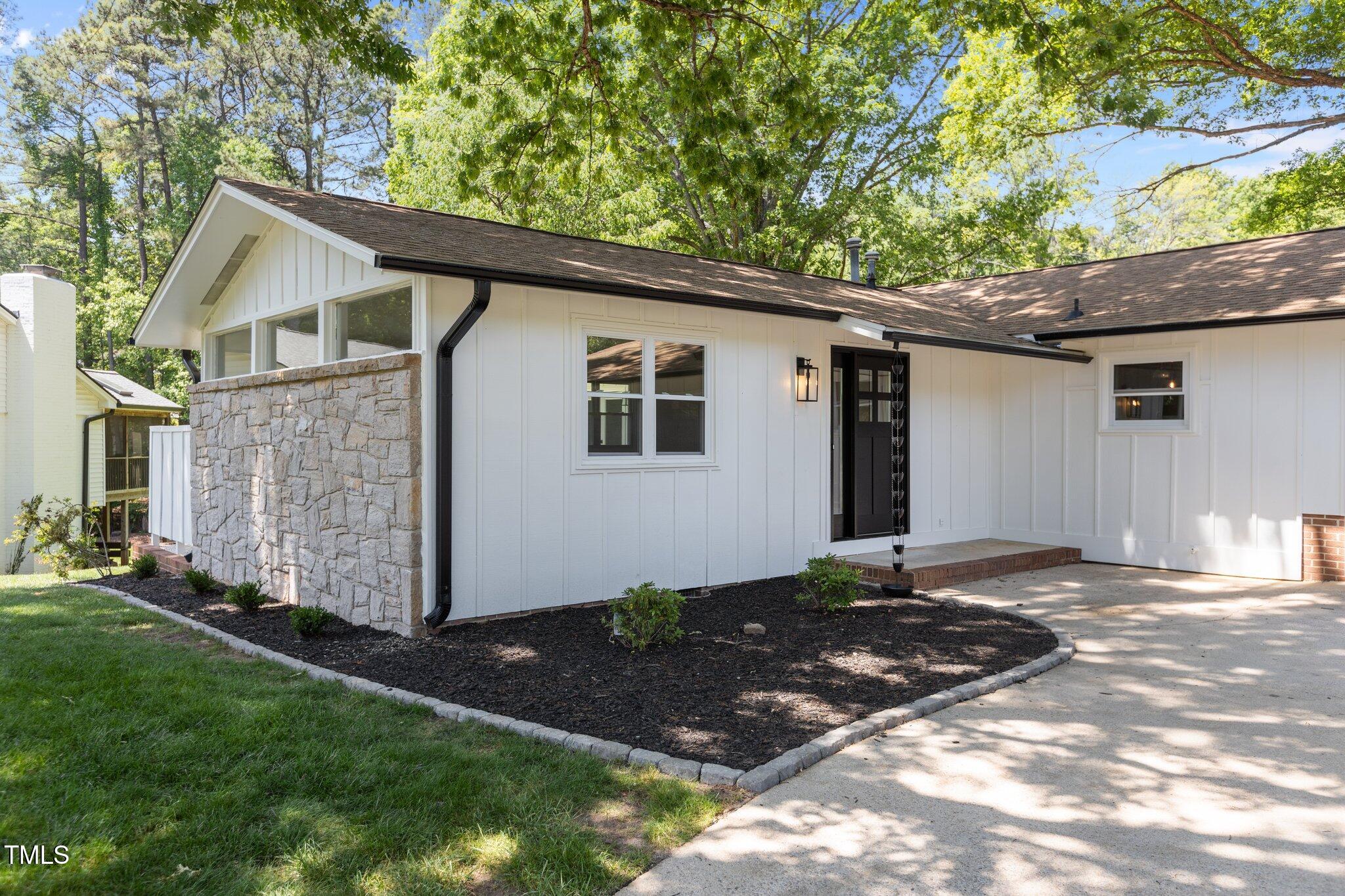 2505 Catalina Court Raleigh, NC 27607 - Photo 2 of 25 a backyard of a house with lots of green space