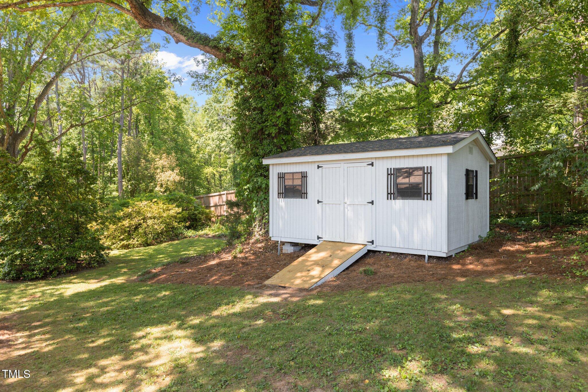 2505 Catalina Court Raleigh, NC 27607 - Photo 22 of 25 a view of a backyard with a tree