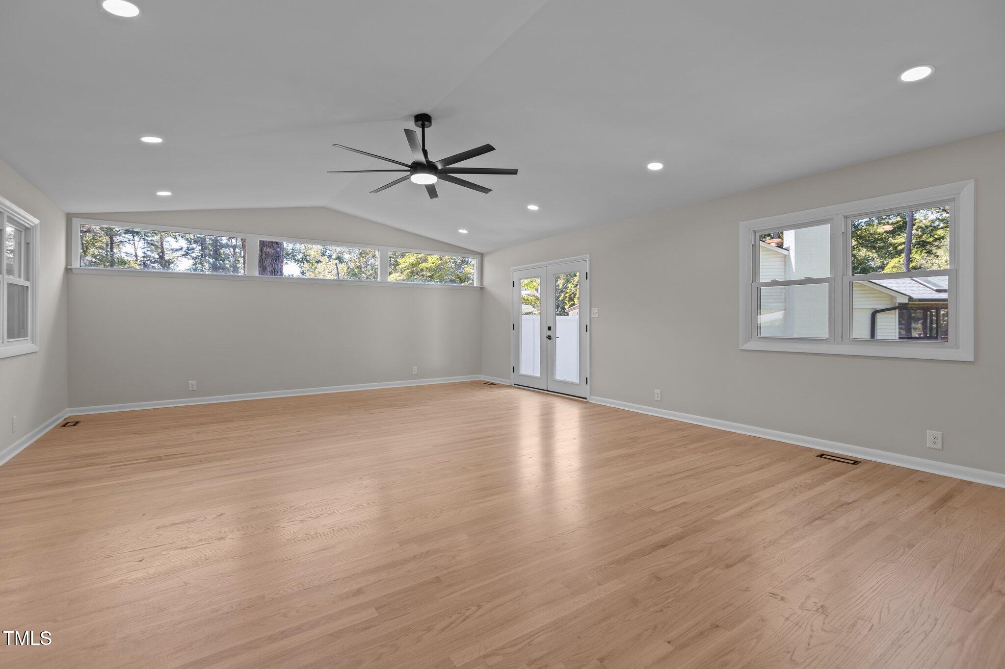 2505 Catalina Court Raleigh, NC 27607 - Photo 9 of 25 a view of empty room with wooden floor and fan