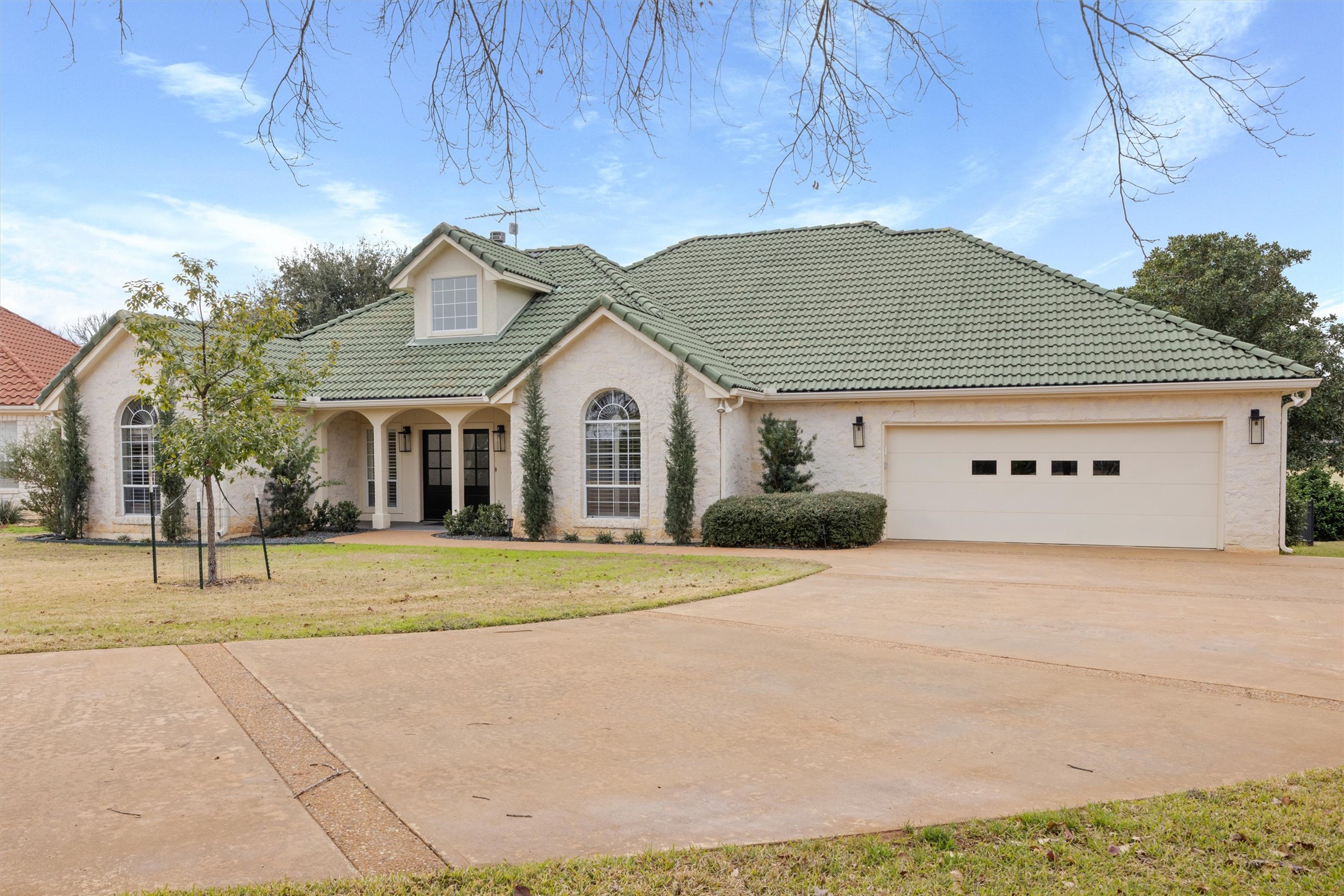 700 Shadow Hill Road Horseshoe Bay, TX 78657 - Photo 2 of 23 a view of yellow house with a outdoor space