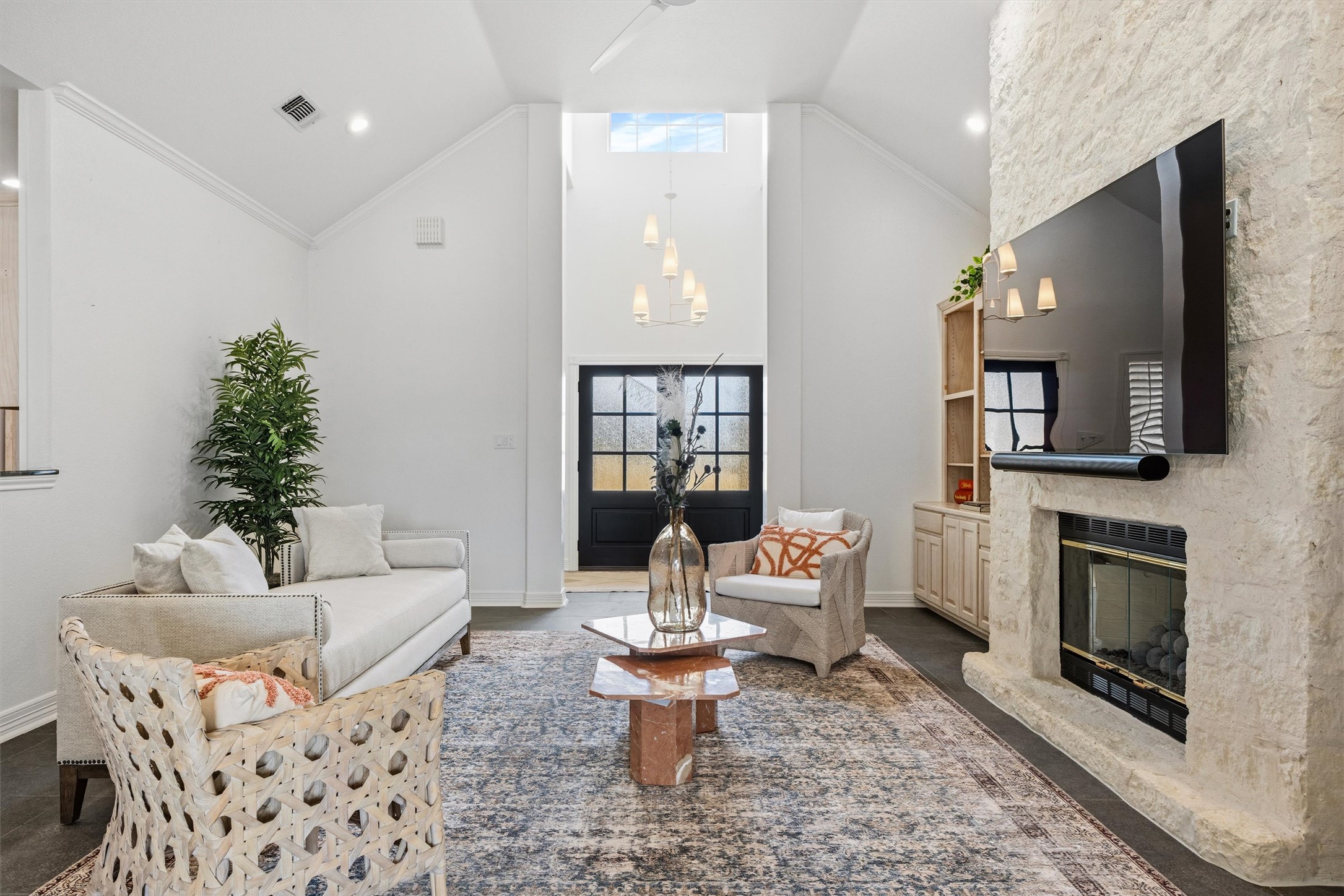 700 Shadow Hill Road Horseshoe Bay, TX 78657 - Photo 5 of 23 a living room with furniture a flat screen tv and a fireplace