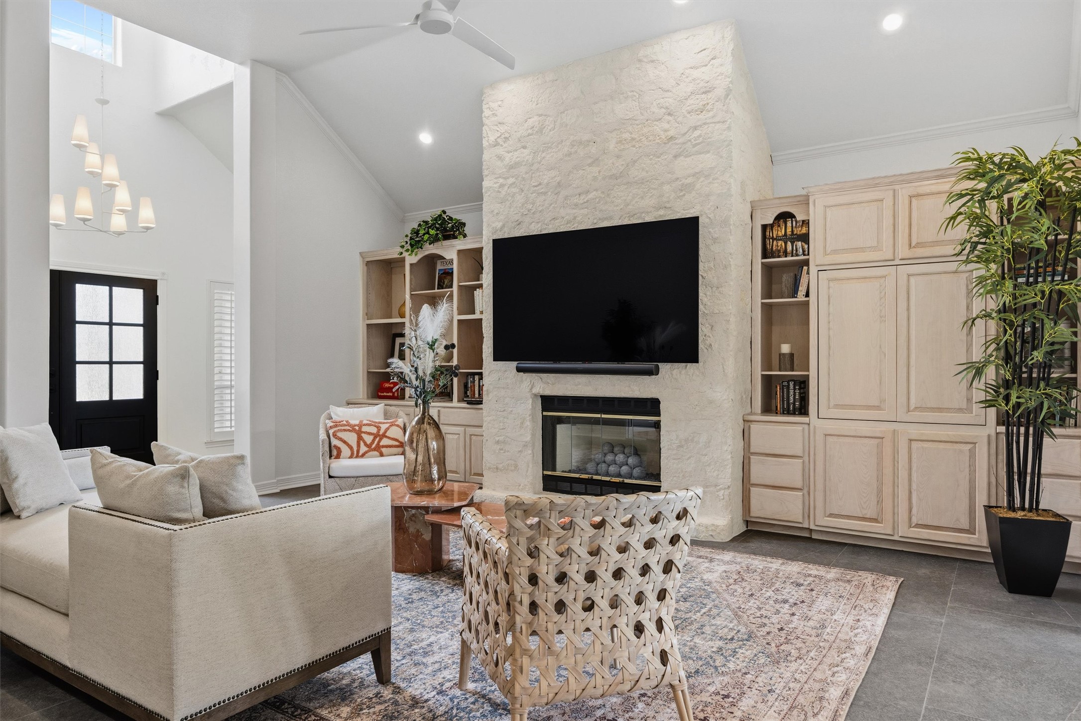 700 Shadow Hill Road Horseshoe Bay, TX 78657 - Photo 6 of 23 a living room with furniture a flat screen tv and a fireplace