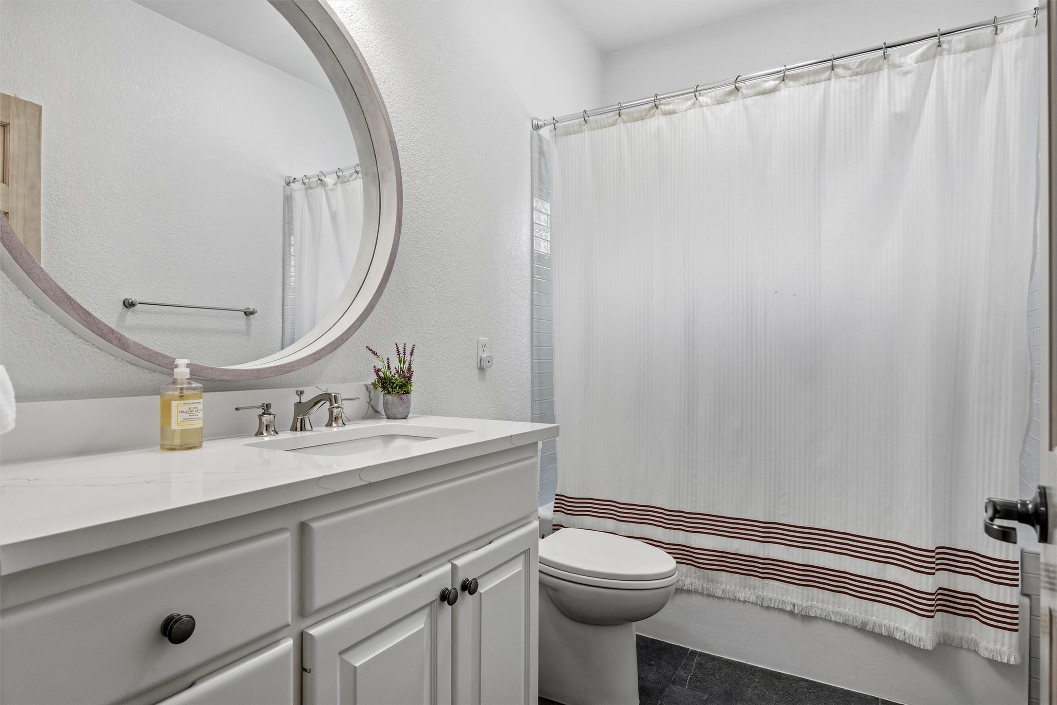 700 Shadow Hill Road Horseshoe Bay, TX 78657 - Photo 10 of 23 a bathroom with a sink a toilet and a mirror