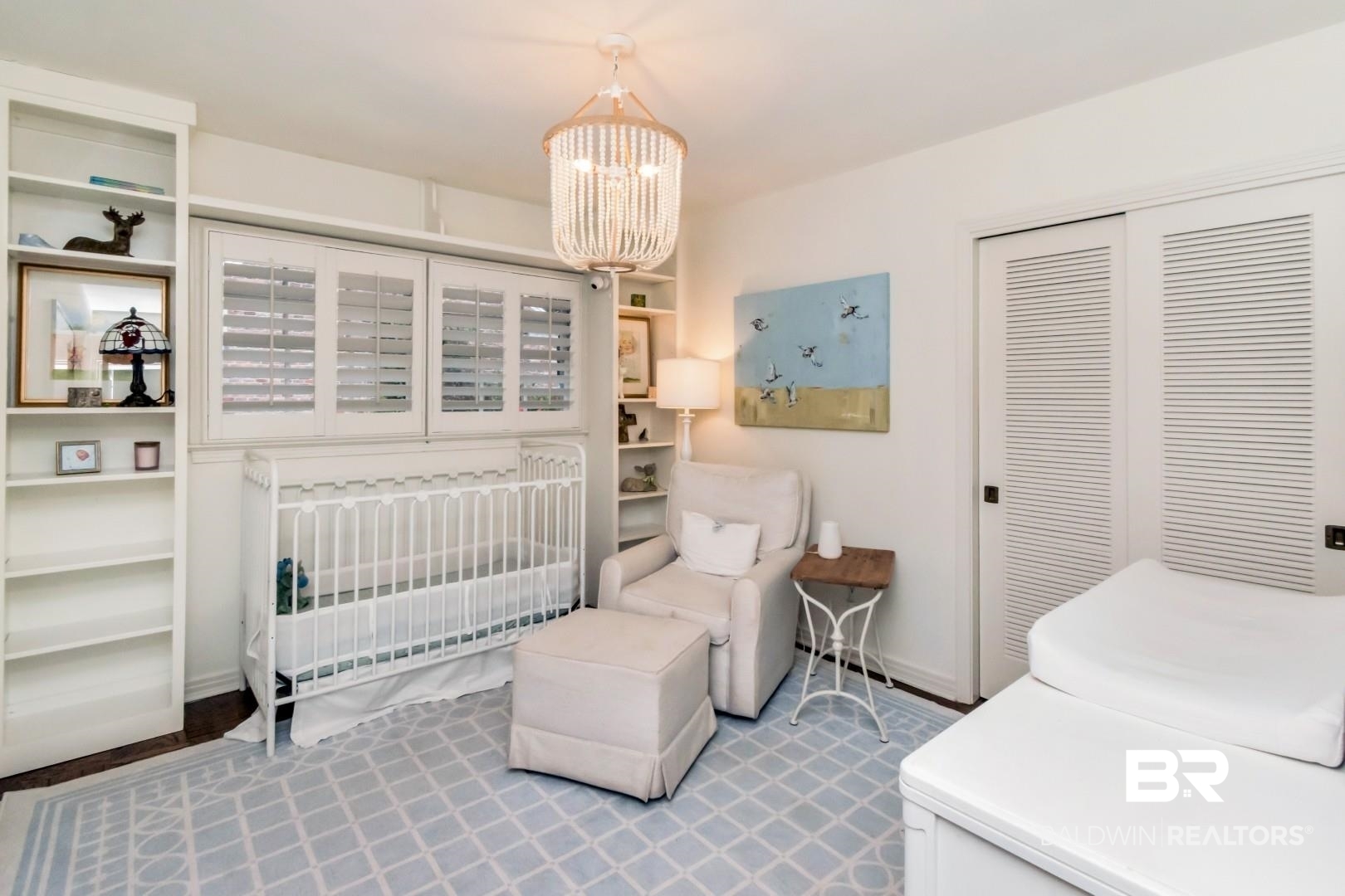 154 Fenwick Road Mobile, AL 36608 - Photo 26 of 48 Bedroom with a nursery area, a chandelier, and a closet