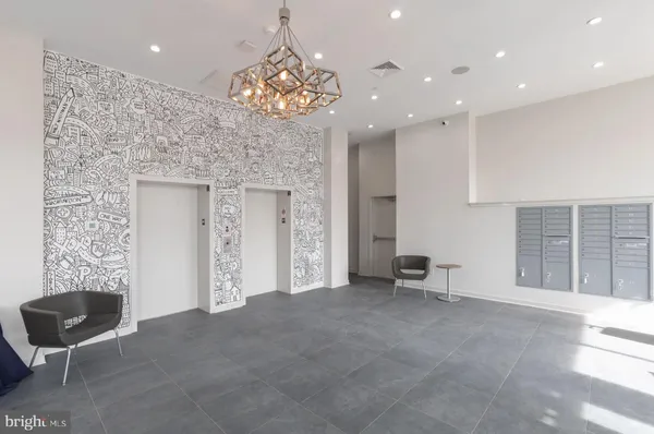 an empty room with windows and ceiling fan