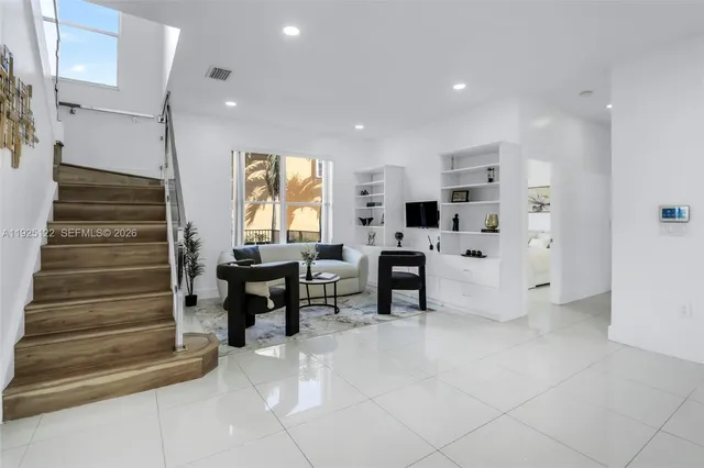a view of living room with furniture and window