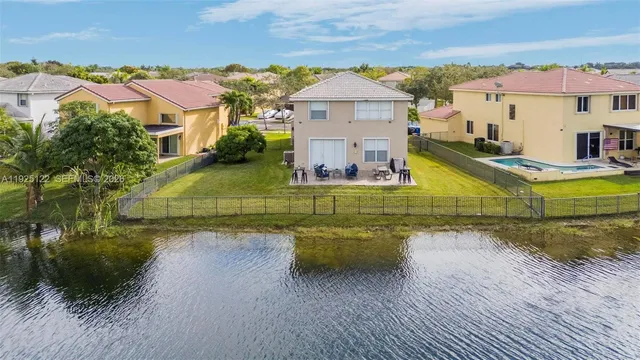 an aerial view of a houses with a outdoor space