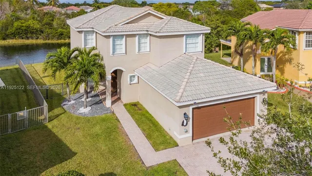 an aerial view of residential houses and outdoor space