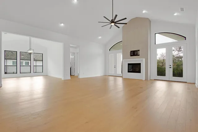 a living room with furniture kitchen view and a fireplace