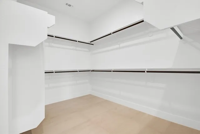 a spacious bathroom with a bathtub and shower