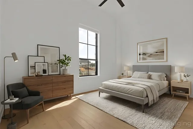 a bedroom with a bed and window