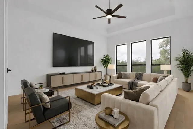 a living room with furniture and a flat screen tv