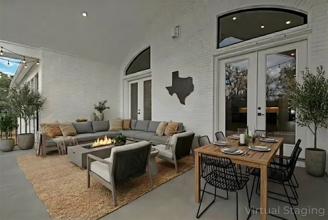 a view of an empty room with glass door and a window