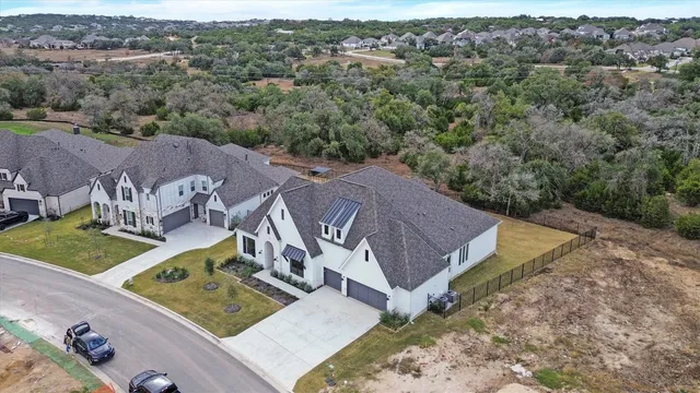 an aerial view of a house with outdoor space