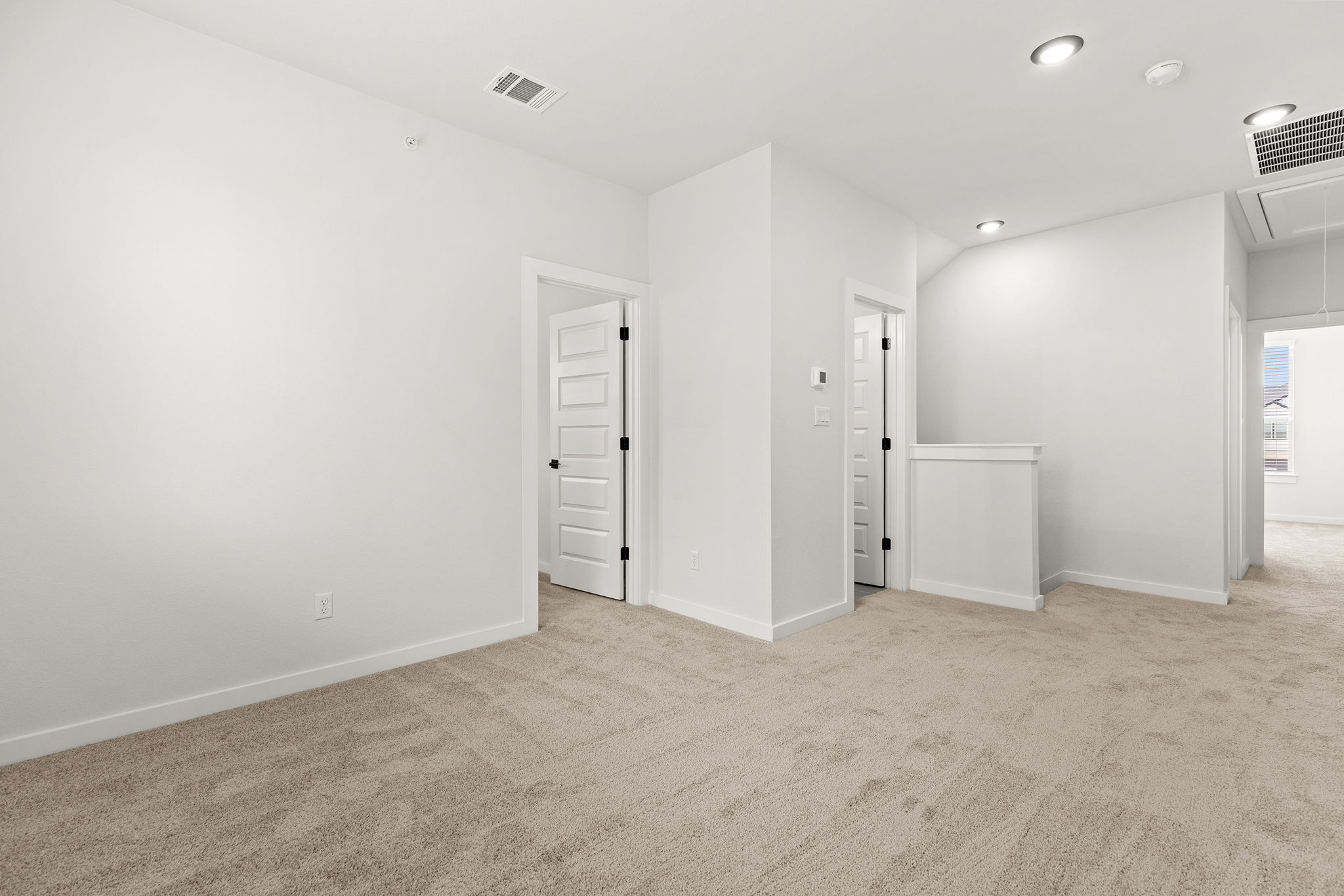 2600 Gattis School Road, Unit 1001 Round Rock, TX 78664 - Photo 25 of 40 A well-lit interior space offers a neutral palette, awaiting personalized touches.