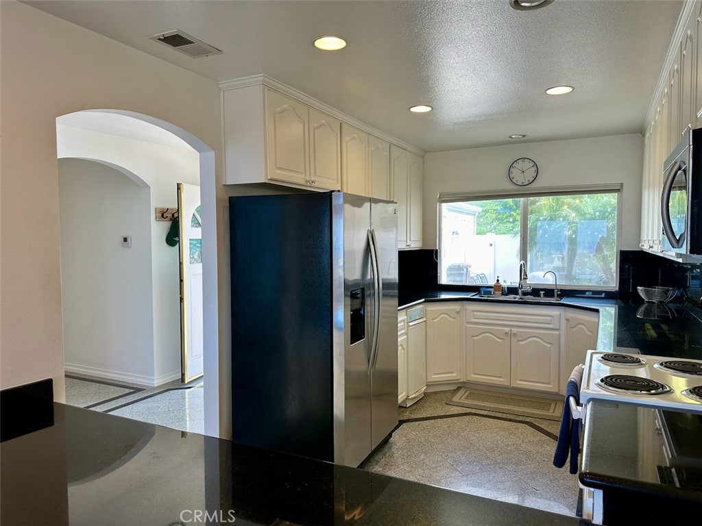 33635 Capstan Drive Dana Point, CA 92629 - Photo 12 of 33 a kitchen with a refrigerator and a stove top oven