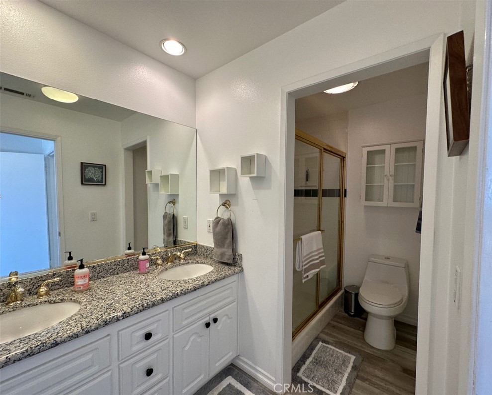 33635 Capstan Drive Dana Point, CA 92629 - Photo 16 of 33 a bathroom with a granite countertop sink toilet and shower