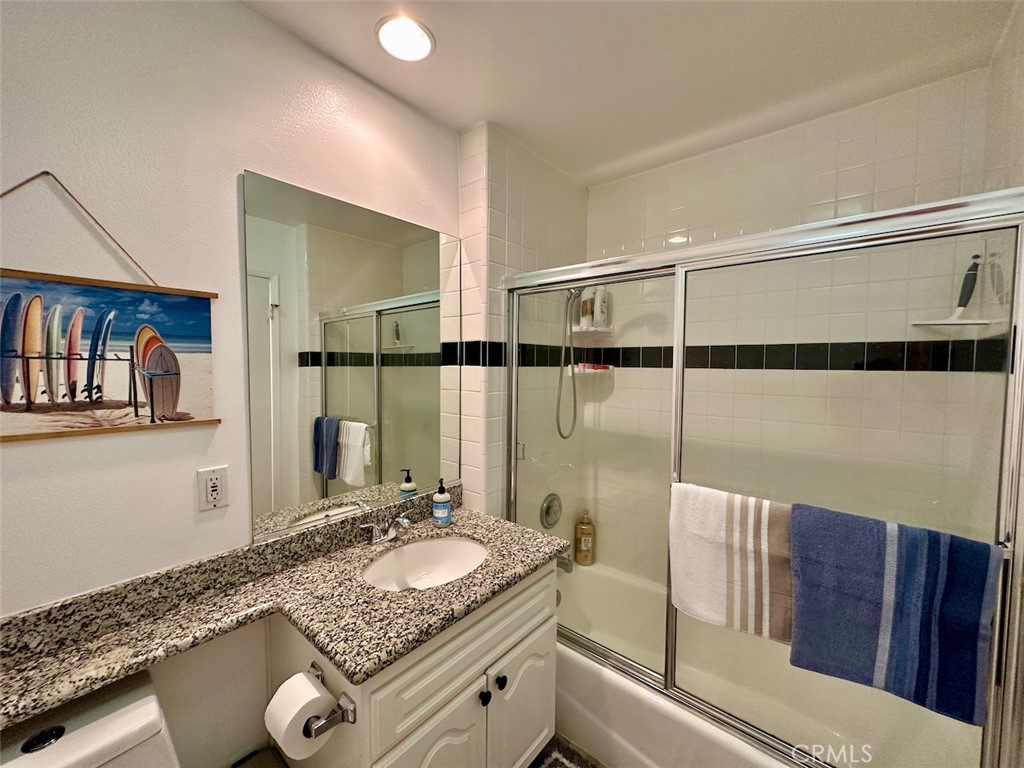 33635 Capstan Drive Dana Point, CA 92629 - Photo 20 of 33 a bathroom with a granite countertop sink and a mirror