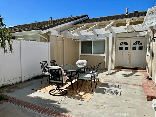a view of a dinning table and chairs in the patio
