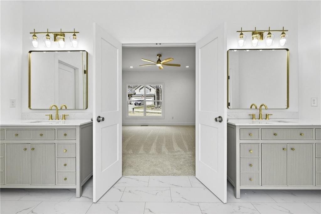 88 Carolyn Path Rockmart, GA 30153 - Photo 29 of 73 a spacious bathroom with a double vanity sink and a mirror