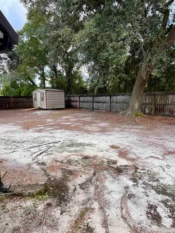 a view of a water fountain and an trees