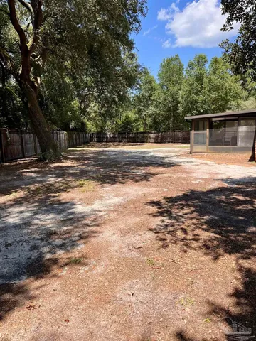 a view of a room with wooden floor and cabinet