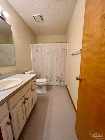 a bathroom with 2 sink and a bathtub