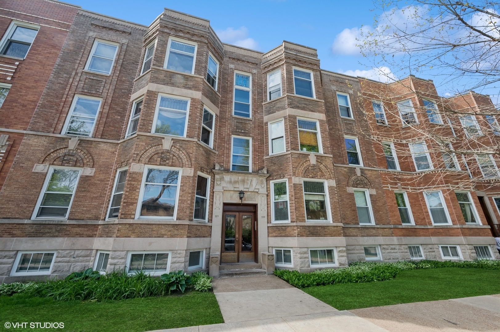 2137 West Cortez Street, Unit 2 Chicago, IL 60622 - Photo 1 of 19 a front view of a multi story residential apartment building