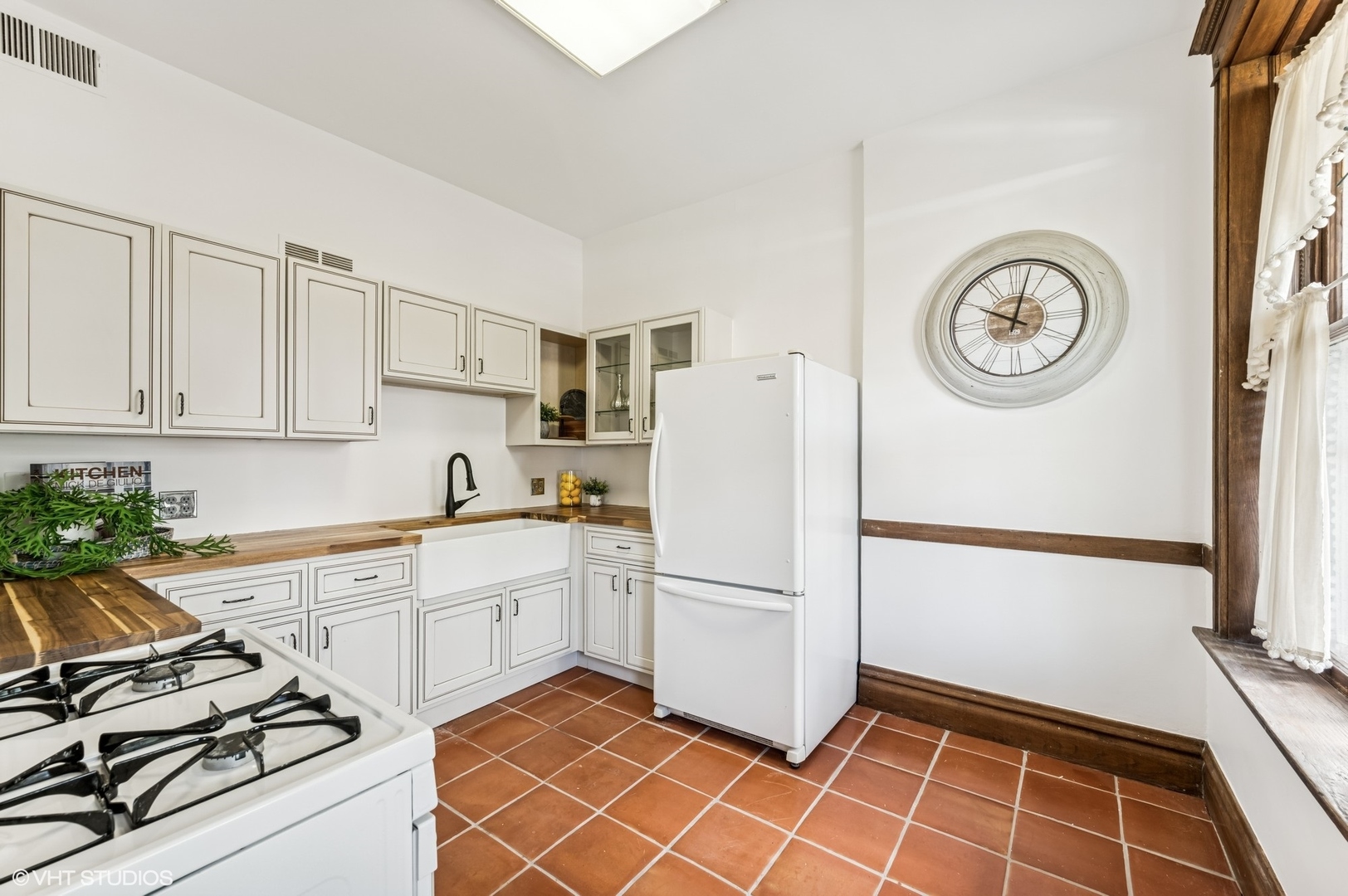 2137 West Cortez Street, Unit 2 Chicago, IL 60622 - Photo 11 of 19 a kitchen with a refrigerator and a stove top oven