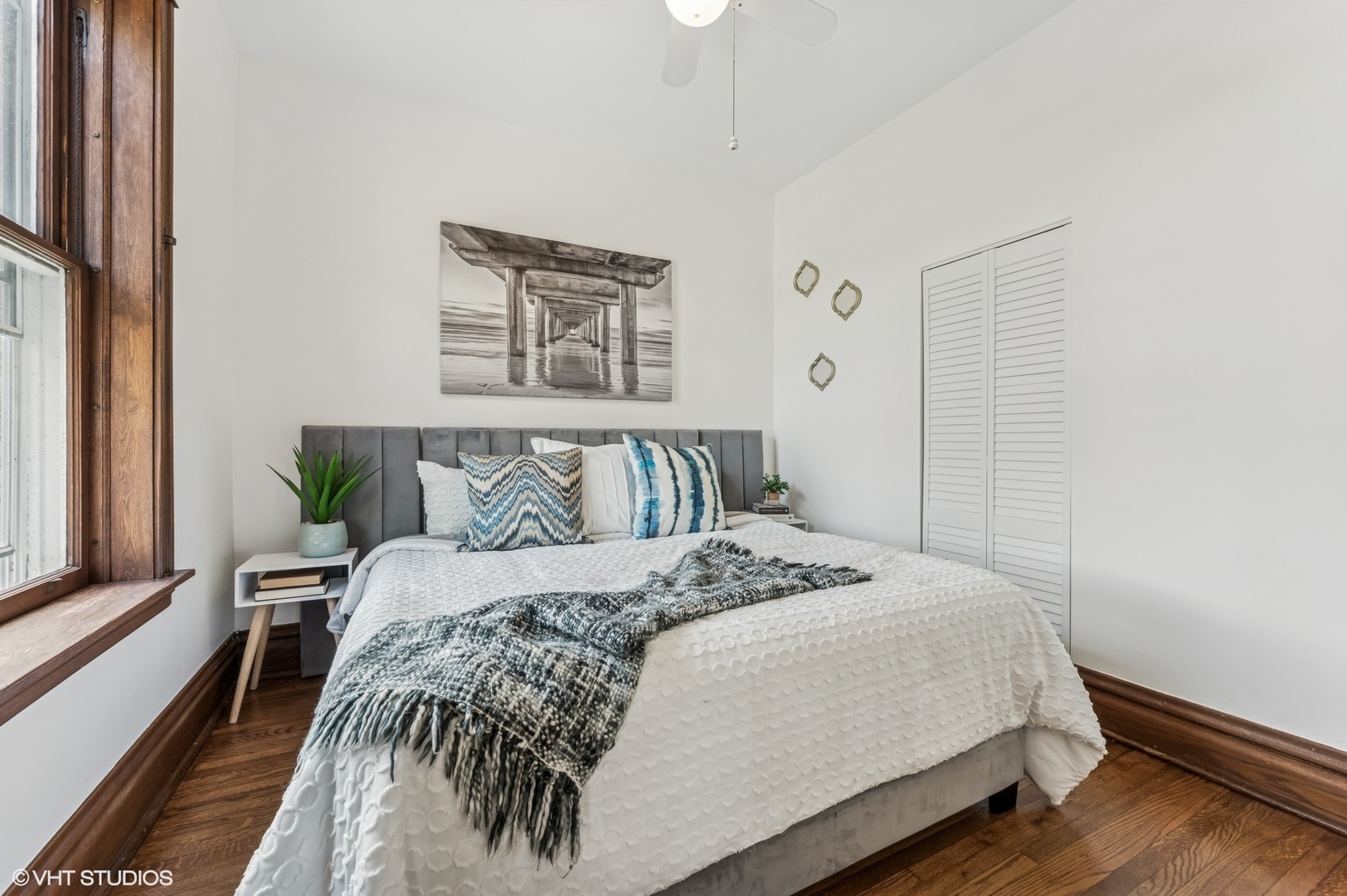 2137 West Cortez Street, Unit 2 Chicago, IL 60622 - Photo 12 of 19 a bedroom with a bed and wooden floor