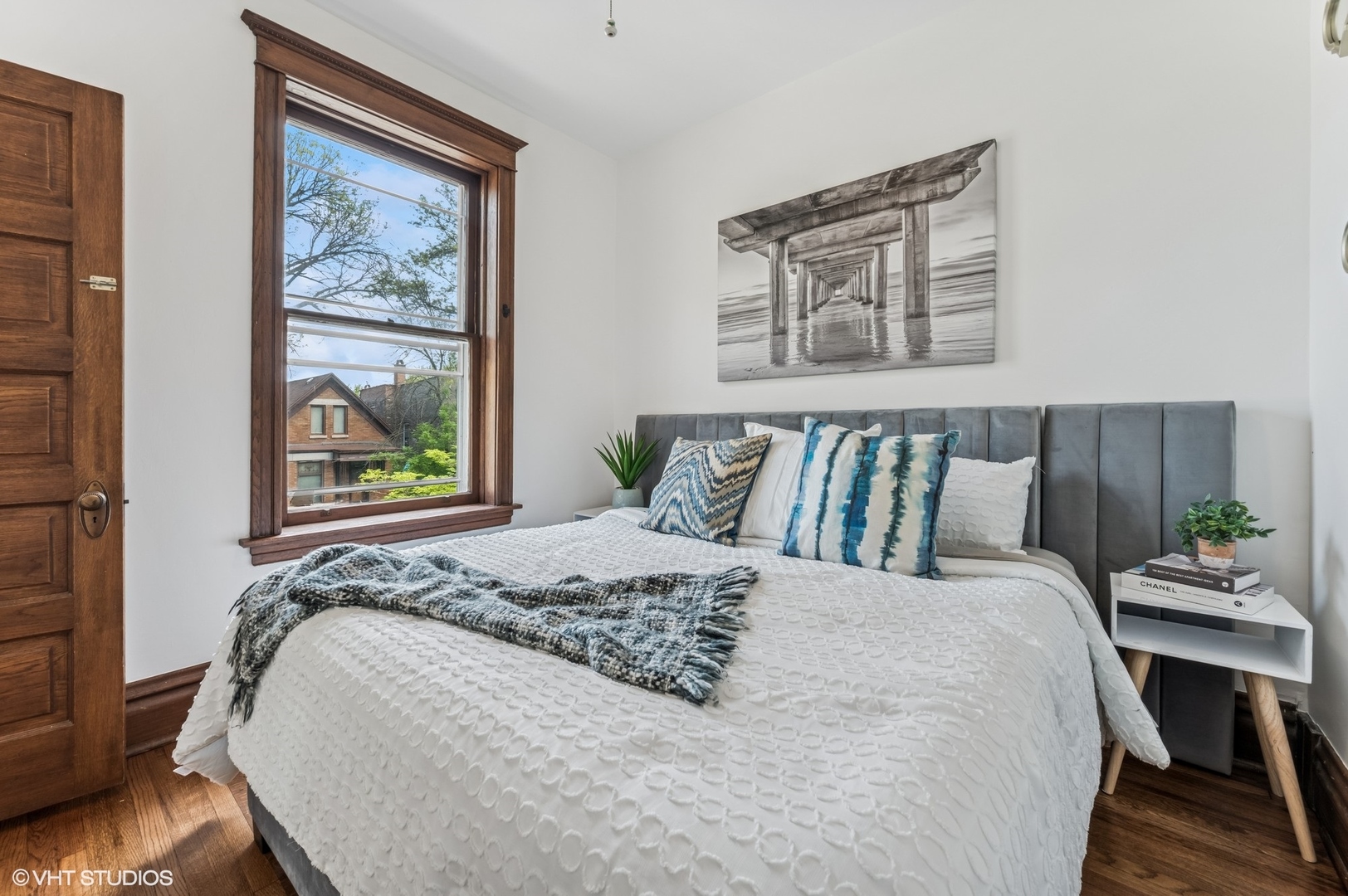 2137 West Cortez Street, Unit 2 Chicago, IL 60622 - Photo 13 of 19 a bed sitting in a bedroom next to a window