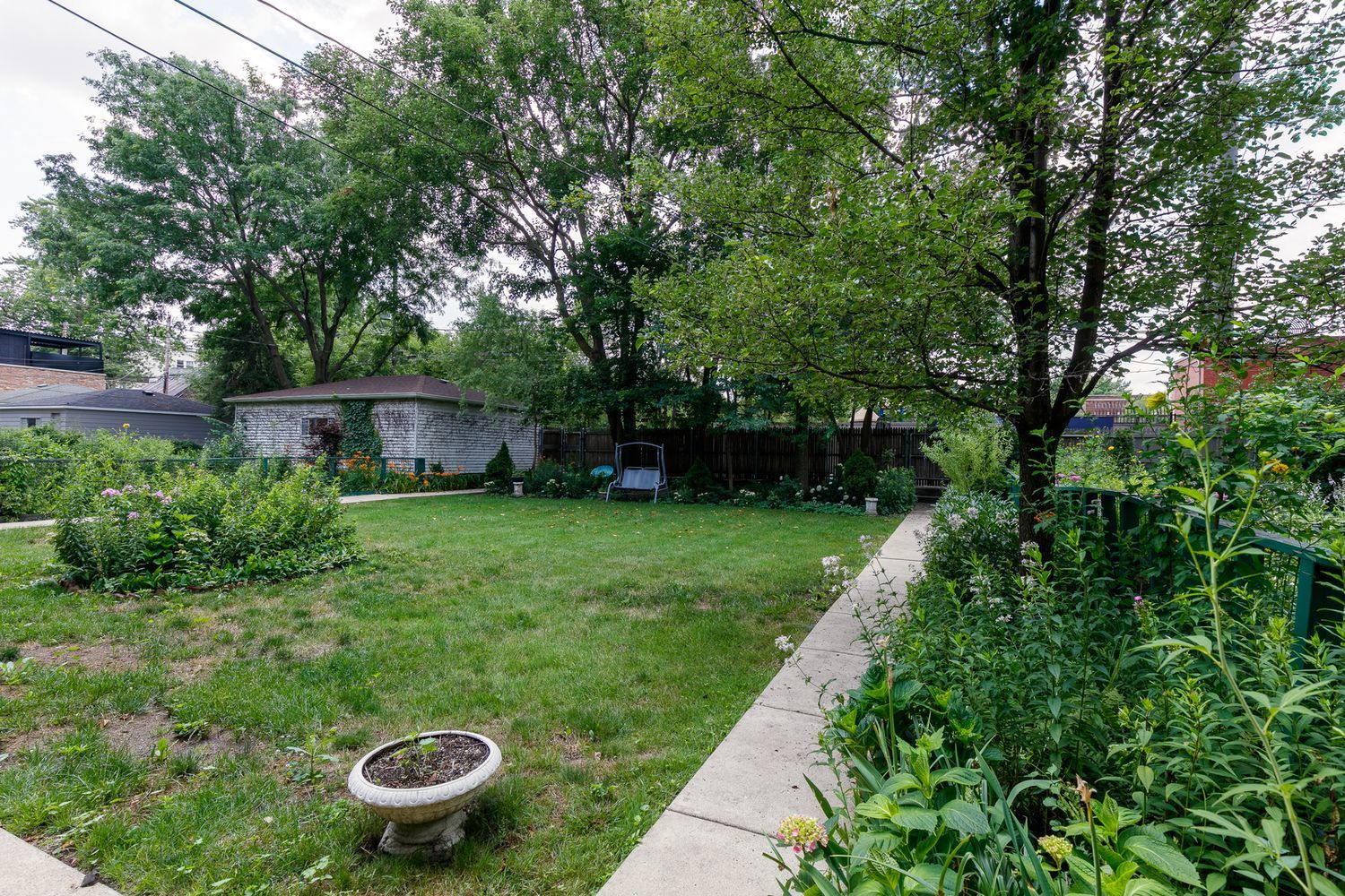 2137 West Cortez Street, Unit 2 Chicago, IL 60622 - Photo 18 of 19 a view of an house with backyard space and garden