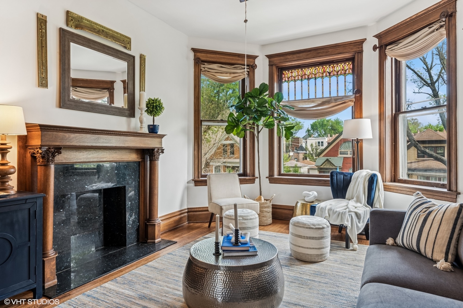 2137 West Cortez Street, Unit 2 Chicago, IL 60622 - Photo 5 of 19 a living room with furniture a fireplace and a large window