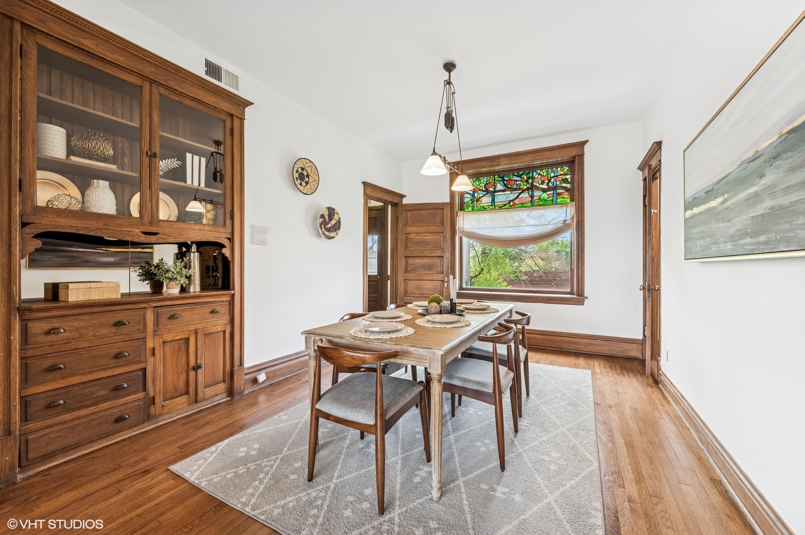 2137 West Cortez Street, Unit 2 Chicago, IL 60622 - Photo 8 of 19 a view of a dining room with furniture window and wooden floor