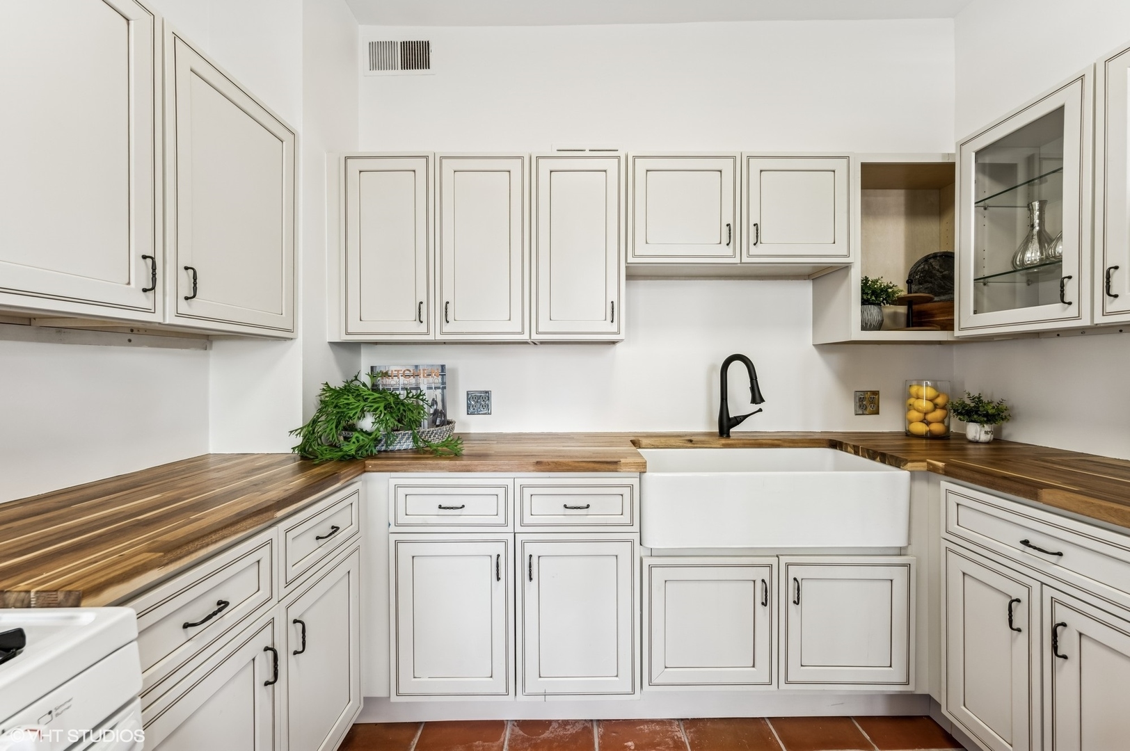 2137 West Cortez Street, Unit 2 Chicago, IL 60622 - Photo 10 of 19 a kitchen with white cabinets and sink