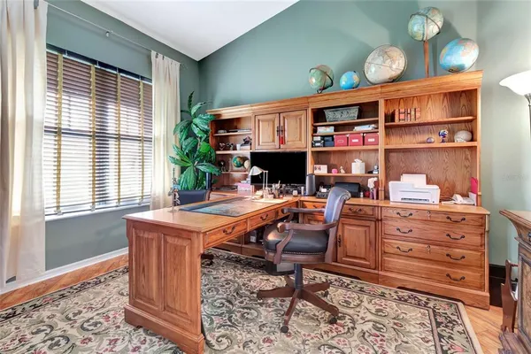 a view of a workspace with furniture